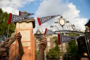 Photo of students holding pennants.
